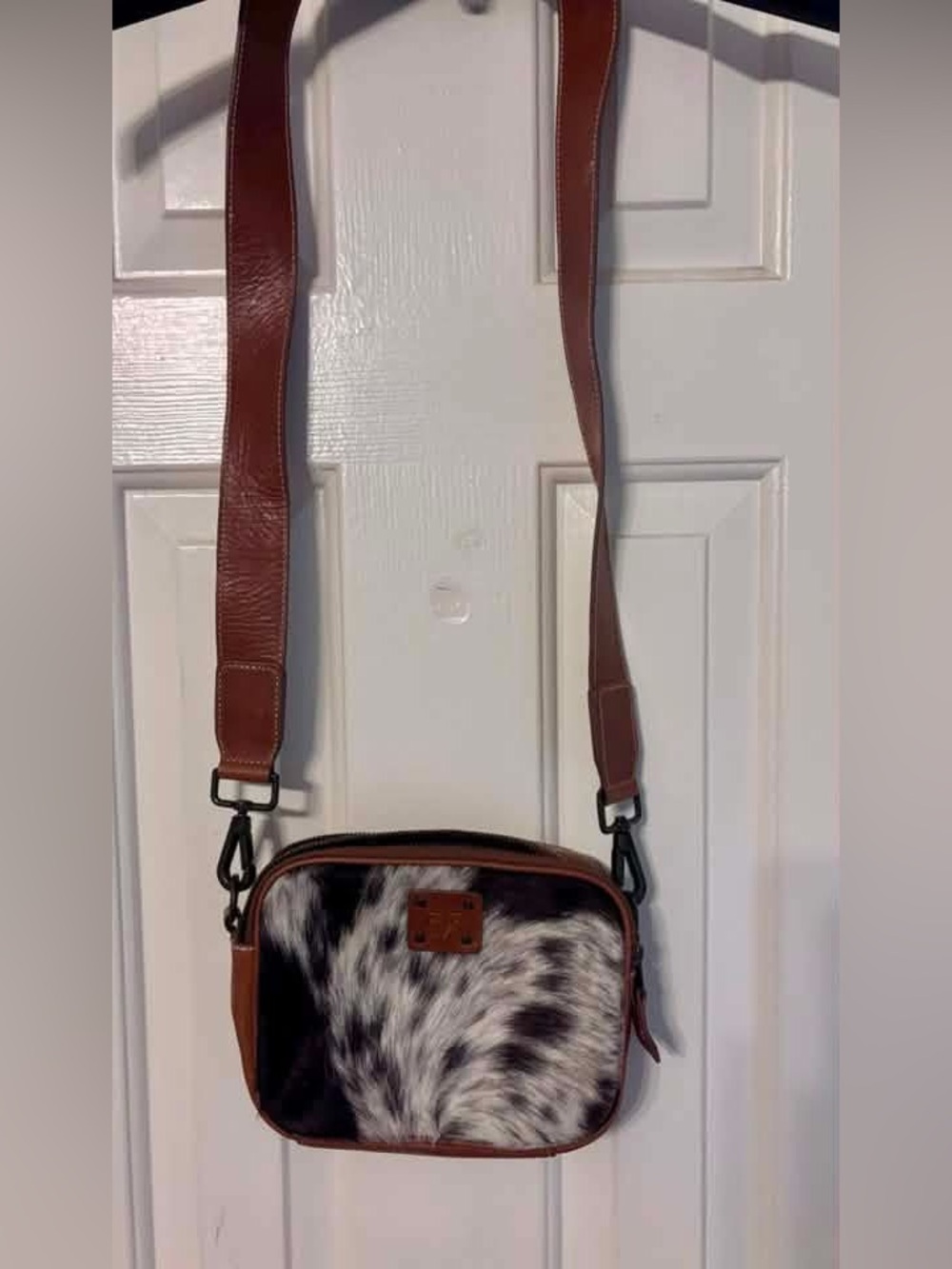 STS Ranchwear Brown Leather Crossbody with Black & White Haircalf Front